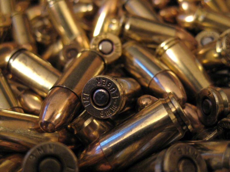 Pile of brass 9mm pistol cartridges