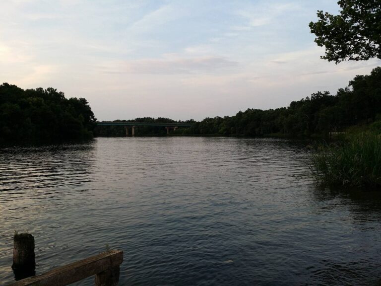 The Flint River at dusk with wooded banks near Bainbridge in Decatur County