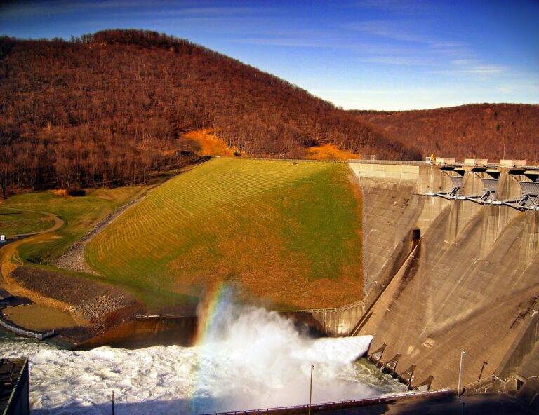 Kinzua Dam and its spillway in late-day light below autumn hills, Allegheny National Forest, Warren County
