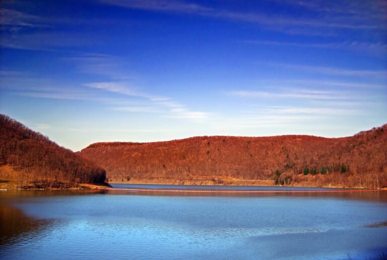 Allegheny Reservoir in late-day light with rust-colored hills, Warren County