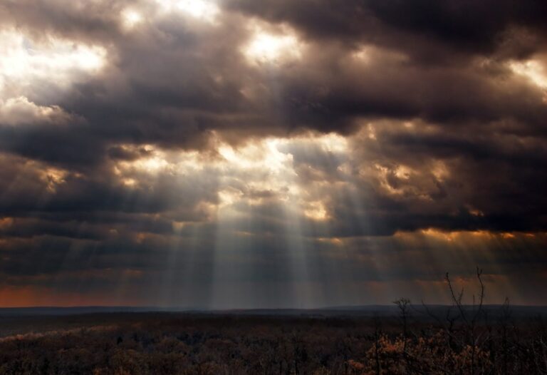 Sunbeams breaking through clouds over the plateau from Pine Hill, Pinchot State Forest