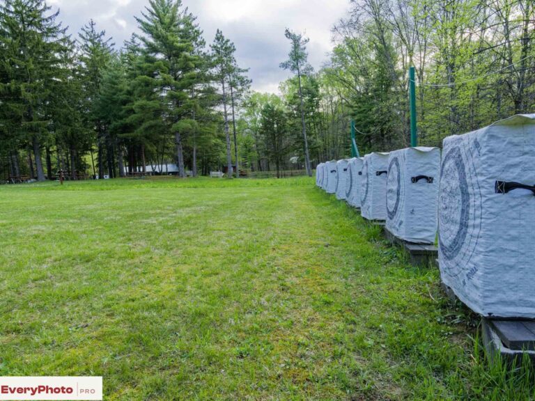 Row of foam archery target butts on a grassy range