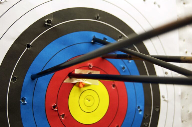 Arrows clustered near the gold of an archery target