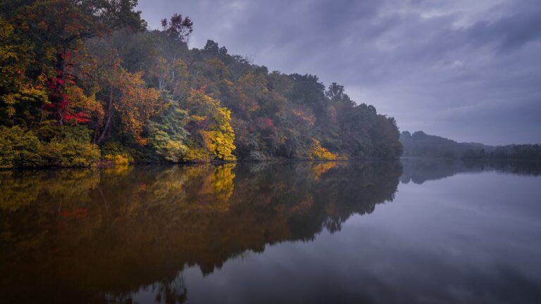 Autumn trees reflected in Twin Lakes at blue hour, Westmoreland County