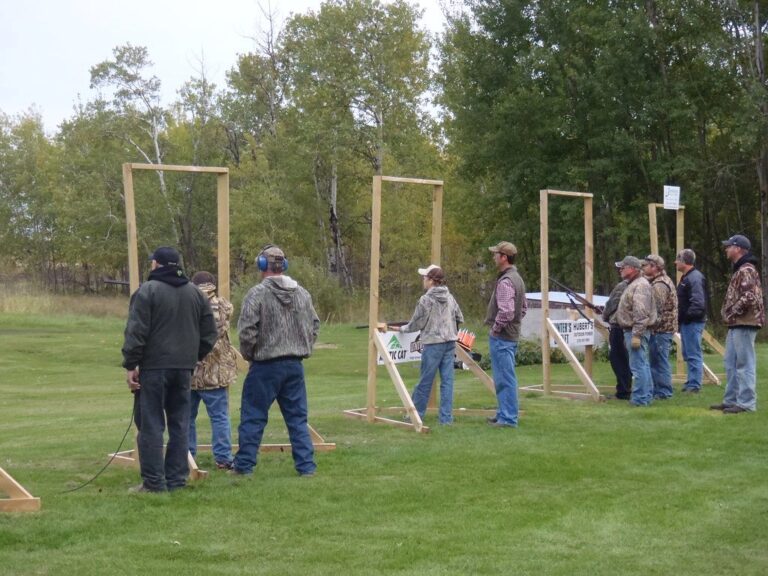 A squad of shooters at a clay target range